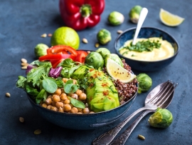 Bowl with healthy salad and dip.